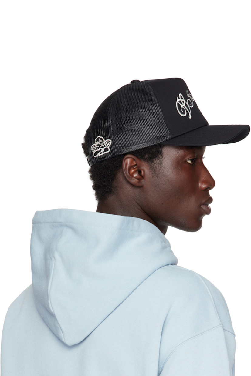 Mesh and cotton gabardine cap. 

· Embroidered logo at face and back face
· Curved brim
· Embroidered graphic patches at back face
· Snapback fastening
· Partially lined

Supplier color: Black
