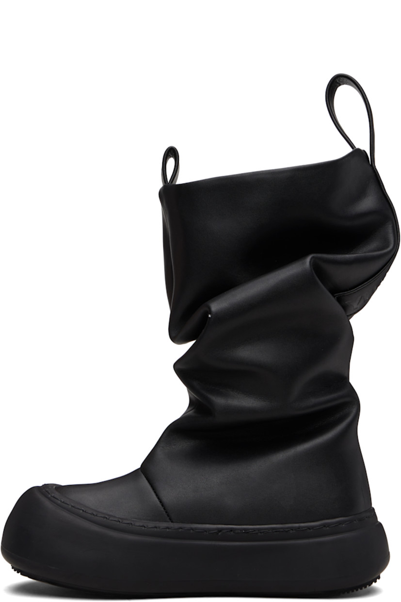 Mid-calf buffed recycled leather-blend boots.

· Gathering throughout
· Logo-embossed pull-loops at collar
· Grained faux-leather lining
· Logo-embossed rubber platform midsole
· Treaded rubber sole
· Platform: H1.75"

Supplier color: Black