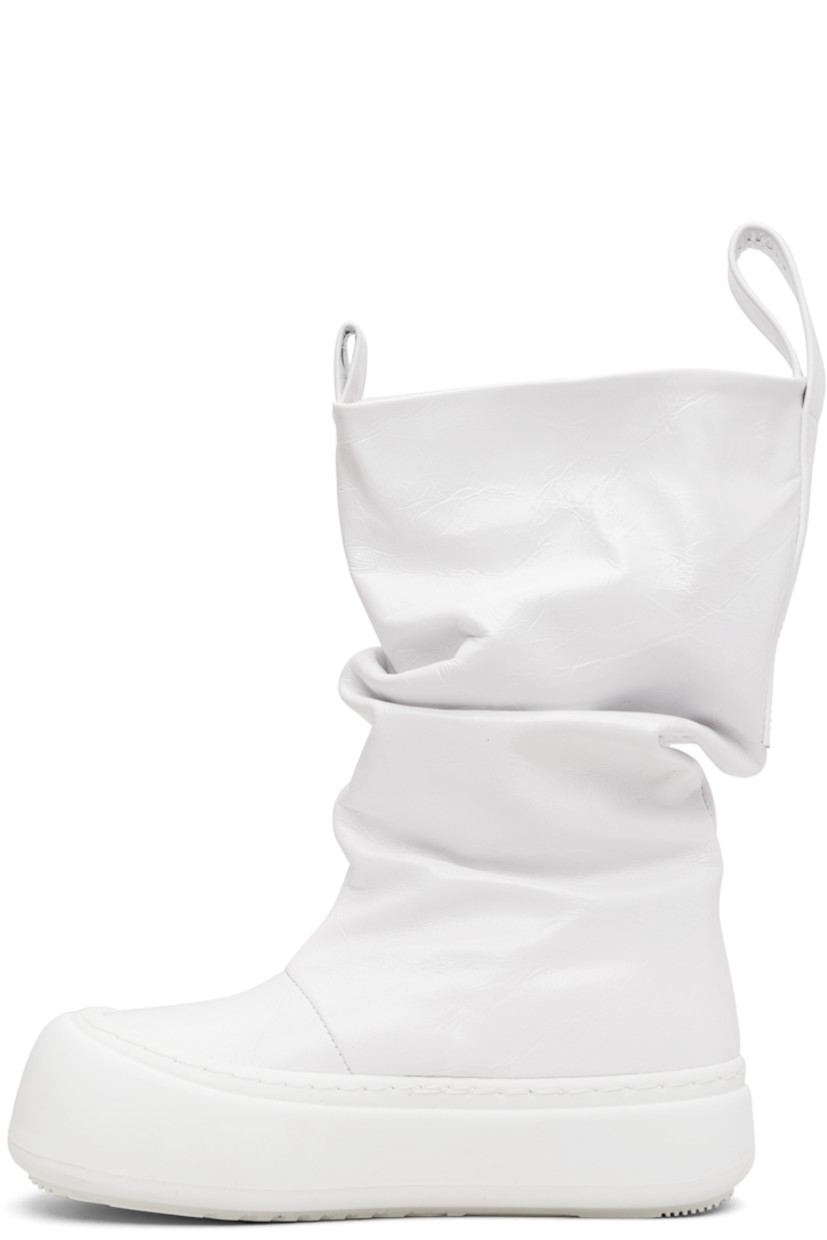 Mid-calf crinkled leather boots.

· Gathering throughout
· Logo-embossed pull-loops at collar
· Grained faux-leather lining
· Logo-embossed rubber platform midsole
· Treaded rubber sole
· Platform: H1.75"

Supplier color: Wrinkled white