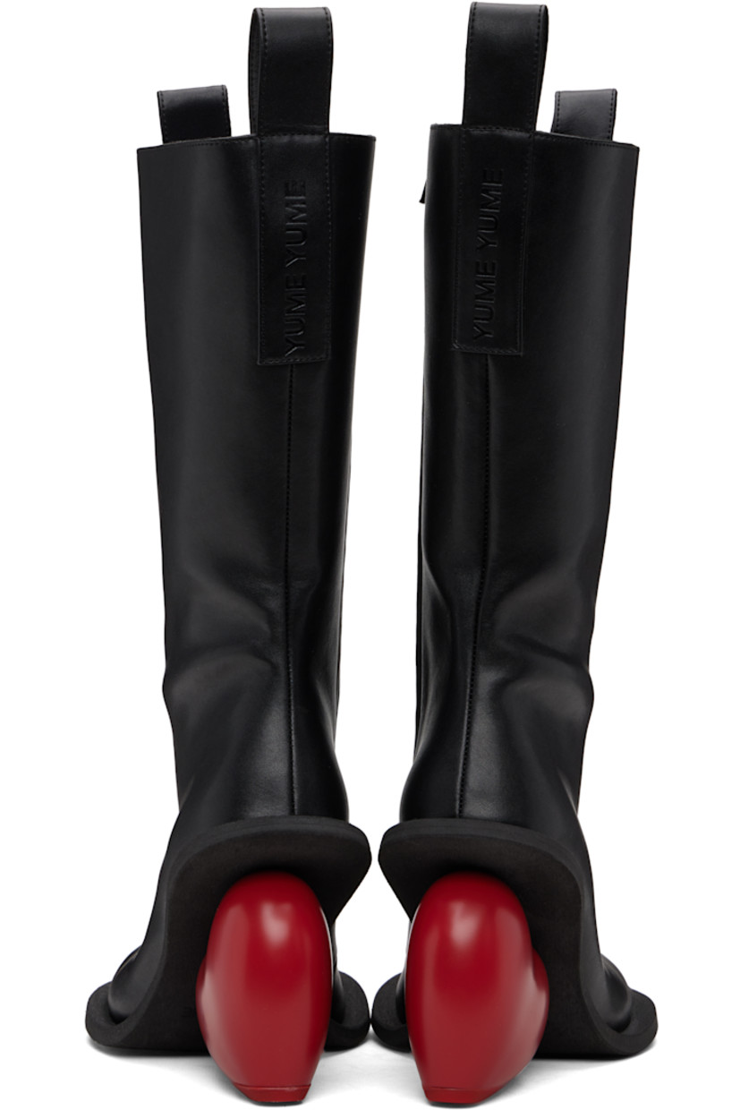 Knee-high buffed recycled leather-blend boots.

· Logo-embossed pull-loops at collar
· Zip closure at inner side
· Grained faux-leather lining
· Sculptural heel
· Rubber sole
· Heel: H4.25"

Supplier color: Black