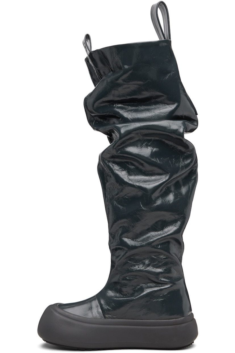 Knee-high crinkled leather boots.

· Gathering throughout
· Logo-embossed pull-loops at collar
· Grained faux-leather lining
· Logo-embossed rubber platform midsole
· Treaded rubber sole
· Platform: H1.75"

Supplier color: Wrinkled grey