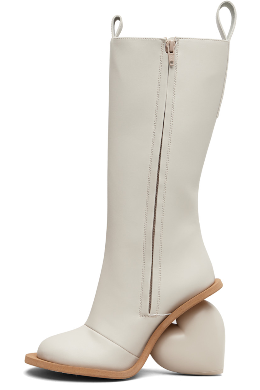Knee-high buffed faux-leather boots.

· Logo-embossed pull-loops at collar
· Zip closure at inner side
· Grained faux-leather lining
· Sculptural heel
· Rubber sole
· Heel: H4.25"

Available exclusively at SSENSE.

Supplier color: Rainday