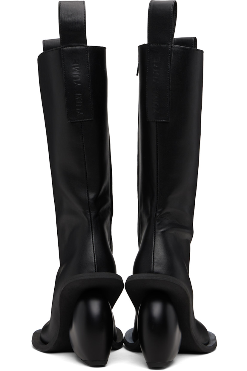 Knee-high buffed faux-leather boots.

· Logo-embossed pull-loops at collar
· Zip closure at inner side
· Grained faux-leather lining
· Sculptural heel
· Rubber sole
· Heel: H4.25"

Available exclusively at SSENSE.

Supplier color: Black