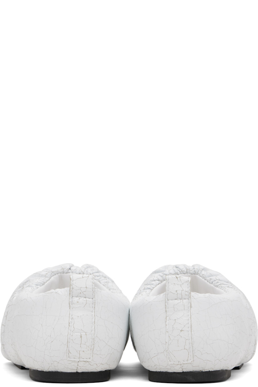 Cracked faux-leather loafers.

· Square toe
· Gathering at collar
· Pull-loop at heel collar
· Buffed faux-leather lining
· Rubber sole

Supplier color: Cracked white