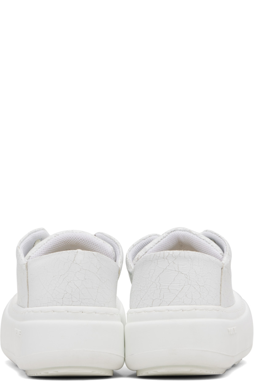 Low-top cracked faux-leather sneakers.

· Lace-up closure
· Padded tongue and collar
· Mesh lining
· Logo-embossed rubber platform midsole
· Treaded rubber sole
· Platform: H1.75"

Supplier color: Cracked white
