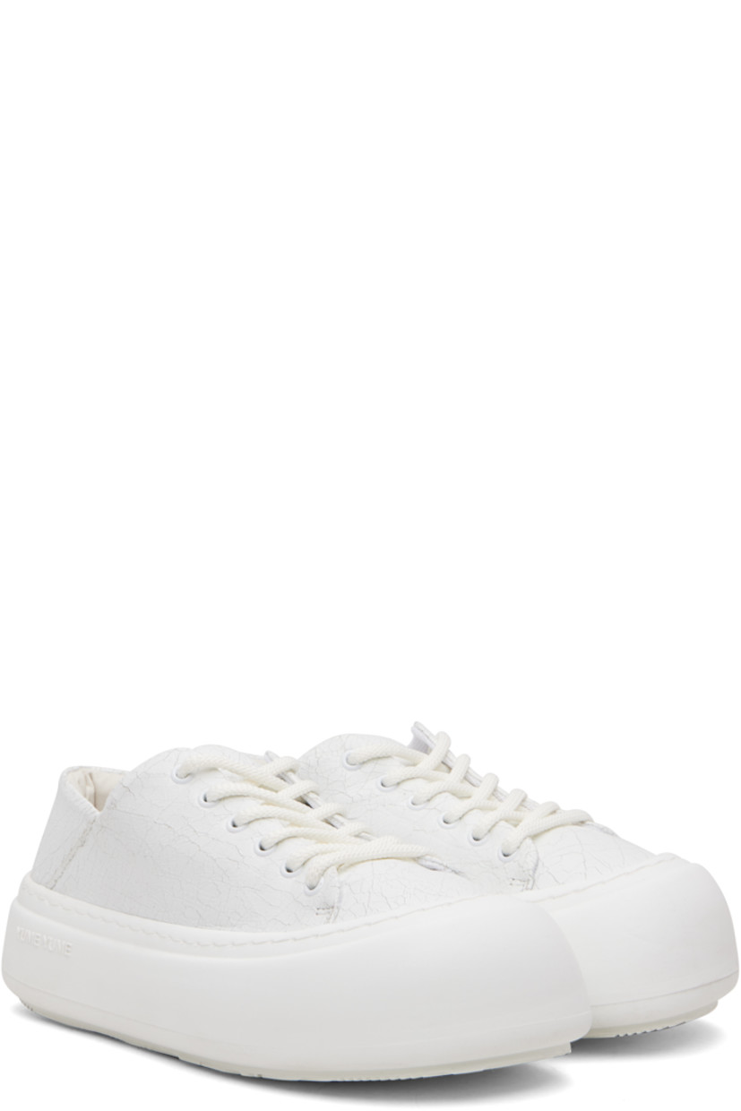 Low-top cracked faux-leather sneakers.

· Lace-up closure
· Padded tongue and collar
· Mesh lining
· Logo-embossed rubber platform midsole
· Treaded rubber sole
· Platform: H1.75"

Supplier color: Cracked white