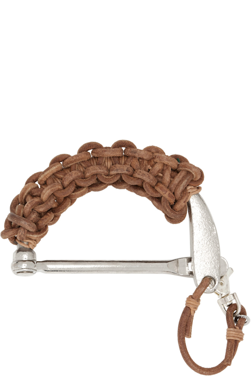 Solid metal handle-style keychain.

· Braided leather trim throughout
· Logo disc at hinged clasp
· H3" x W5"

Supplier color: Natural