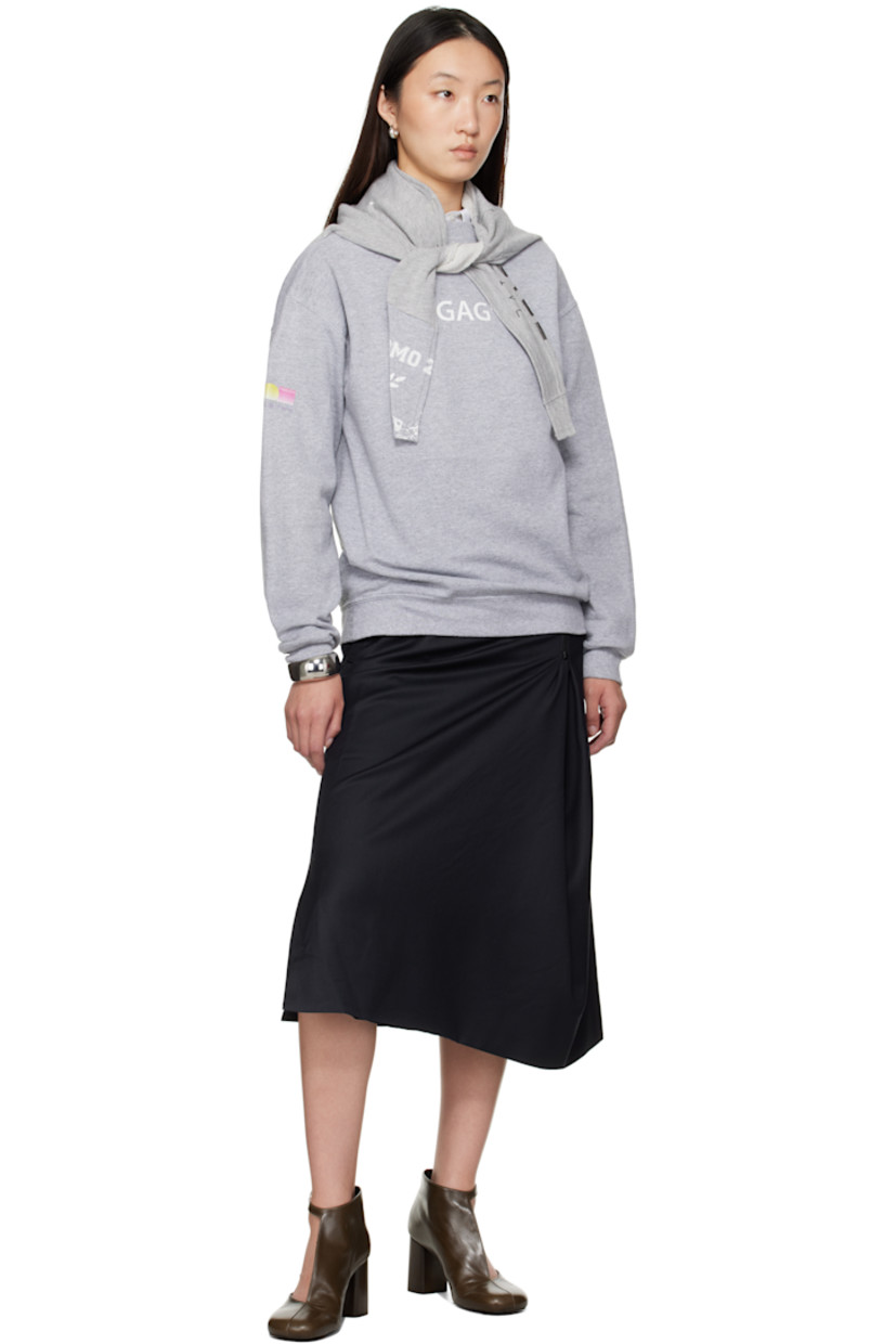 Plain-woven wool midi skirt.

· Wrap construction
· Four-pocket styling
· Adjustable exposed zip fly 
· Full satin lining 

Supplier color: Dark blue
