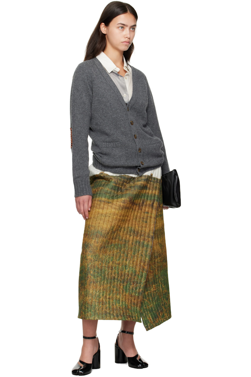 Knit wool cardigan.

· Rib-knit Y-neck, hem, and cuffs
· Button closure
· Patch pockets at front
· Wooden beading at elbows

Supplier color: Grey/Brown