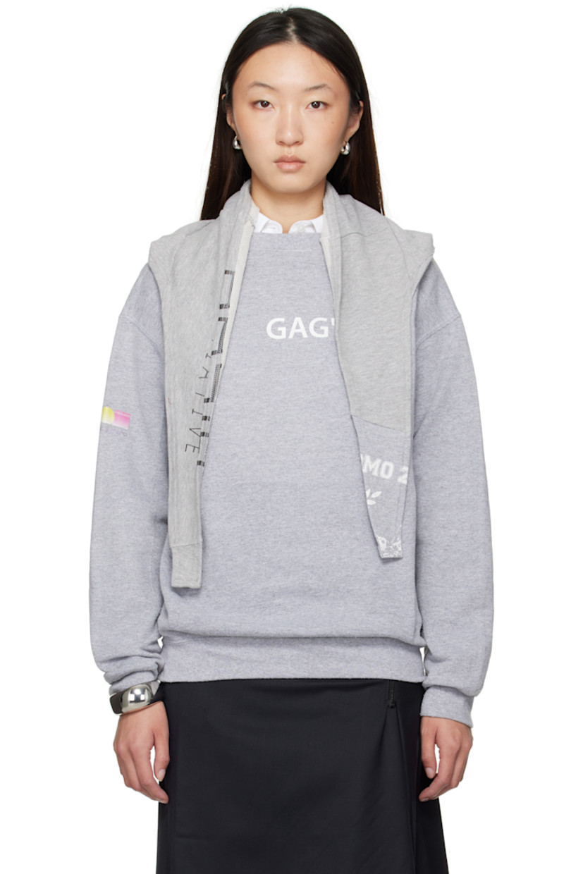 Cotton-blend French terry sweatshirt. 

· Text and graphic printed throughout 
· Integrated self-tie trim at rib-knit crewneck
· Rib-knit hem and cuffs
· Dropped shoulders

Each item is constructed using upcycled garments. Please note colorways and graphics may vary.

Supplier color: Multicolor
