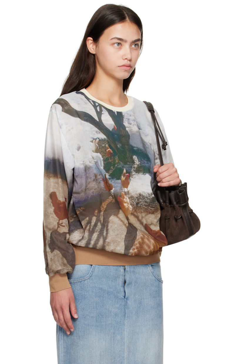 Semi-sheer cotton-blend poplin T-shirt.

· Graphic pattern printed throughout
· Rib-knit crewneck, hem, and cuffs
· Logo disc at side seam

Supplier color: Print