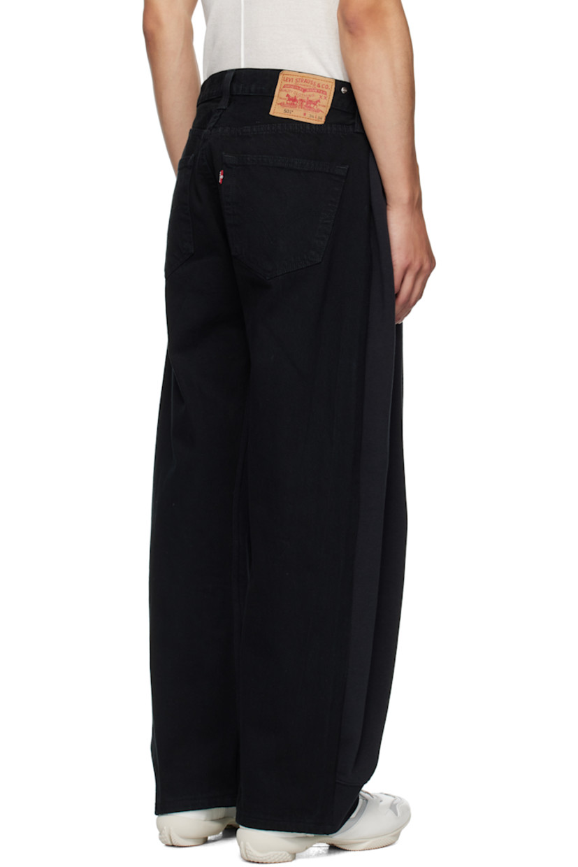 Upcycled cotton-blend fleece and non-stretch denim jeans.

· Drawstring and belt loops at partially elasticized waist
· Five-pocket styling
· Logo embroidered at front
· Logo patch at back waistband
· Logo flag at back pocket

Supplier color: Black/Denimblack