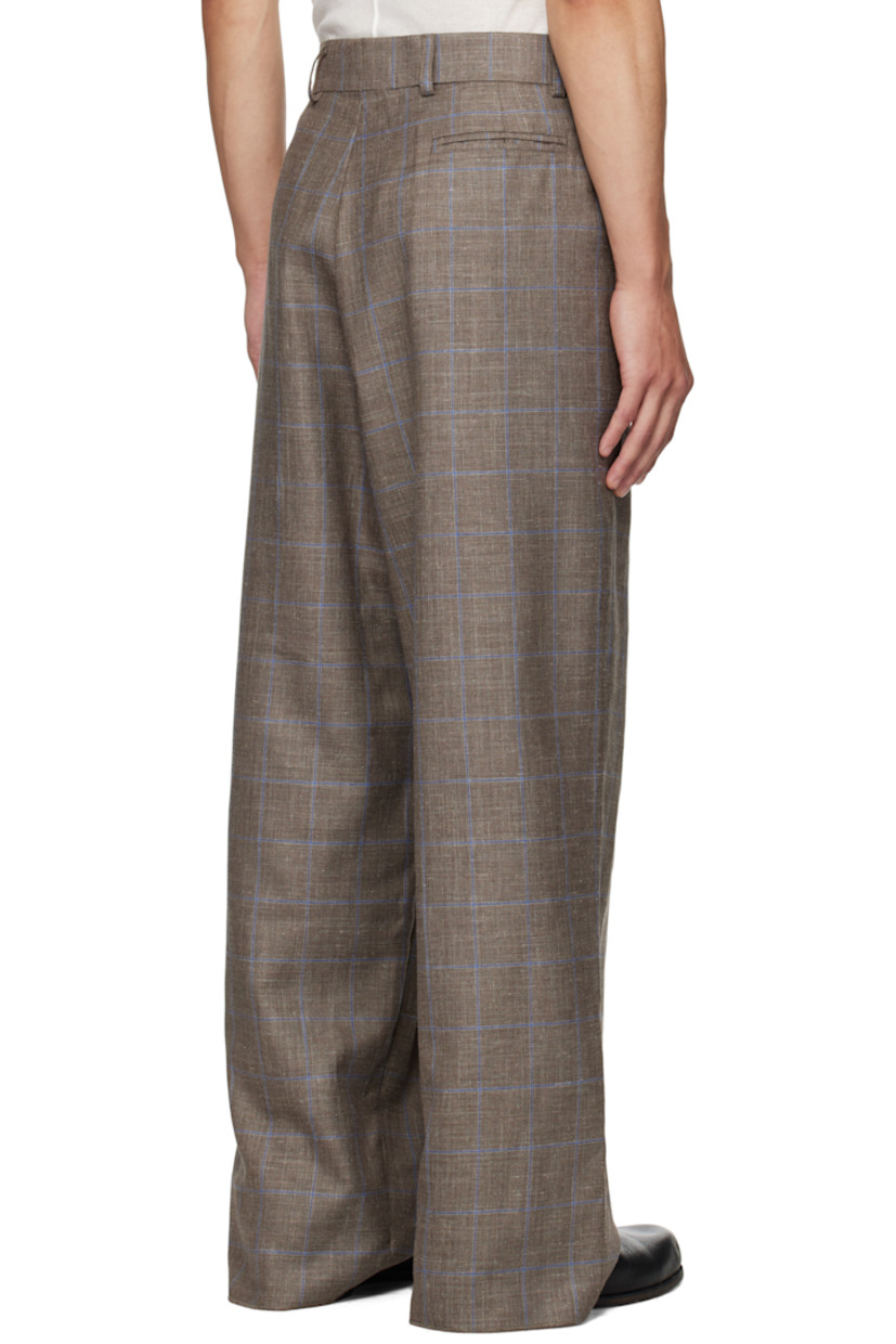 Wool- and silk-blend flannel trousers.

· Check pattern throughout
· Wide-leg
· Pleated waistband with belt loops
· Three-pocket styling
· Zip fly
· Pleats at front
· Logo hardware at front pocket
· Unfinished hem

Supplier color: Grey Blue Checks