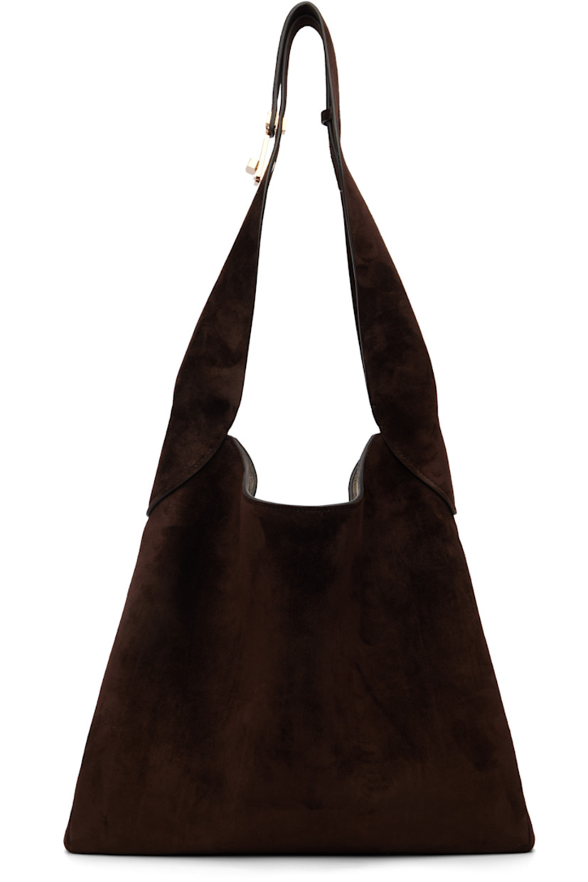Calfskin suede tote.

· Turn-lock fastening at shoulder strap
· Magnetic closure
· H13" x W14" x D2"

Supplier color: Dark brown