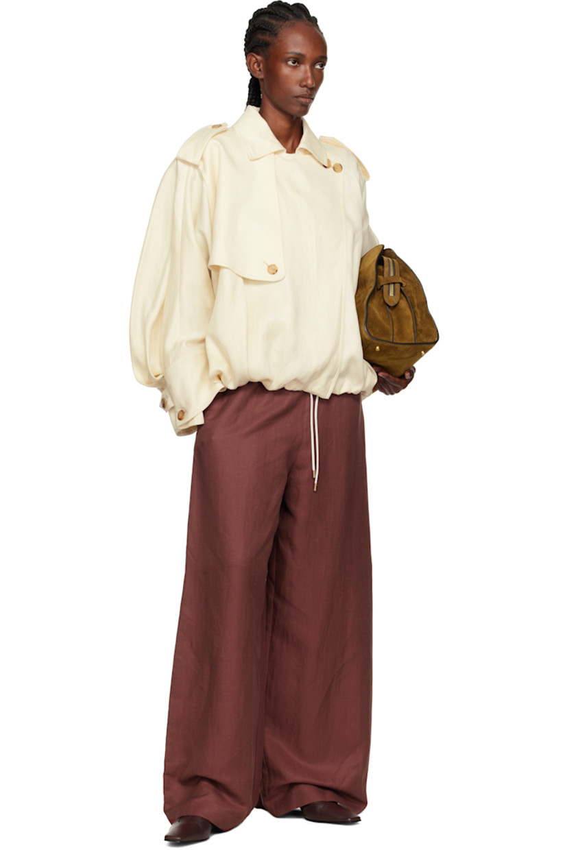 Linen textured hopsack jacket. 

· Oversized
· Spread collar
· Draped button panel at zip closure
· Buttoned storm flap at chest and back yoke 
· Welt pockets at waist
· Gathering and cord-lock drawstring at hem 
· Epaulets
· Button tab at buttoned barrel cuffs

Supplier color: Ivory