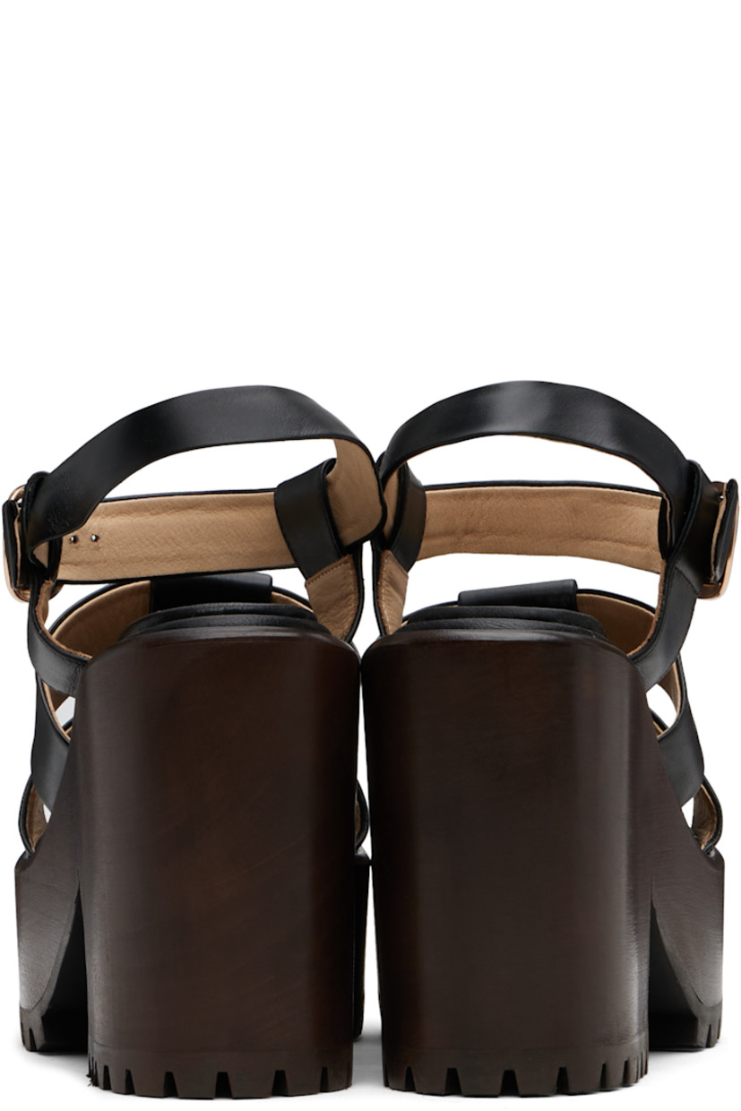 Buffed leather heeled sandals.

· Open almond toe
· Pin-buckle ankle strap
· Logo-embossed padded leather footbed
· Wooden block heel and platform midsole
· Treaded rubber sole
· Platform: H2"
· Heel: H4.25"

Supplier color: Black