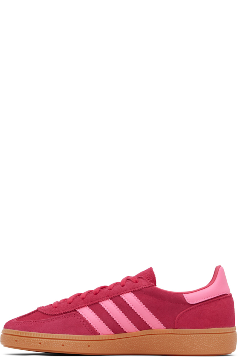 Low-top paneled suede and buffed faux-leather sneakers.

· Lace-up closure 
· Logo patch at padded tongue
· Padded collar
· Signature serrated stripes at sides
· Text and logo stamp at outer side
· Faux-leather lining
· Treaded rubber sole

Supplier color: Ruby red/Lucid pink/Gum 

adidas Kids US Size: child's foot length 
3.5Y: 8.5" / 21.6 cm 
4Y: 8.7" / 22.1 cm 
4.5Y: 8.9" / 22.5 cm 
5Y: 9" / 22.9 cm 
5.5Y: 9.2" / 23.3 cm 
6Y: 9.4" / 23.8 cm 
6.5Y: 9.5" / 24.2 cm 
7Y: 9.7" / 24.6 cm 
7.5Y: 9.8" / 25 cm