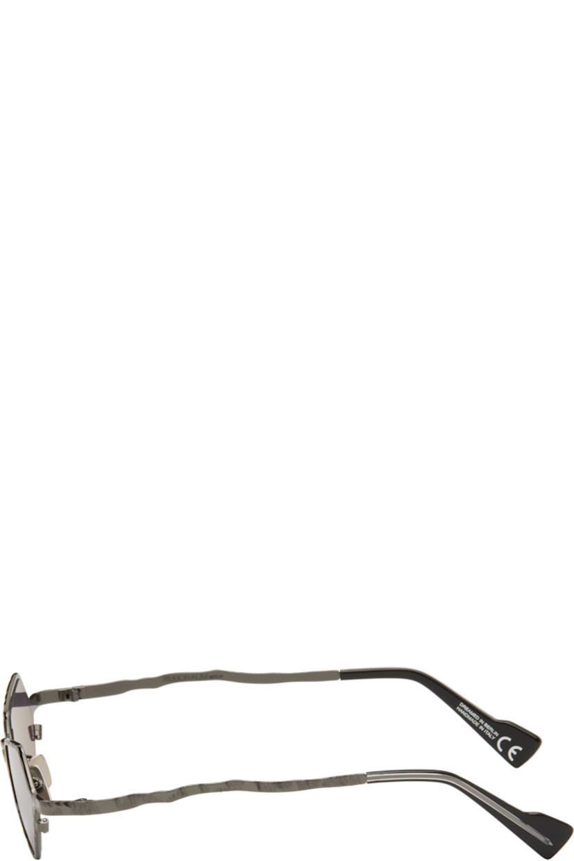 Handcrafted hexagonal metal-frame sunglasses.

· Engraved detailing throughout
· Purple lenses
· Adjustable metal nose pads
· Acetate temple tips
· Includes pouch
· Size: 45.25 145

Supplier color: Gunmetal