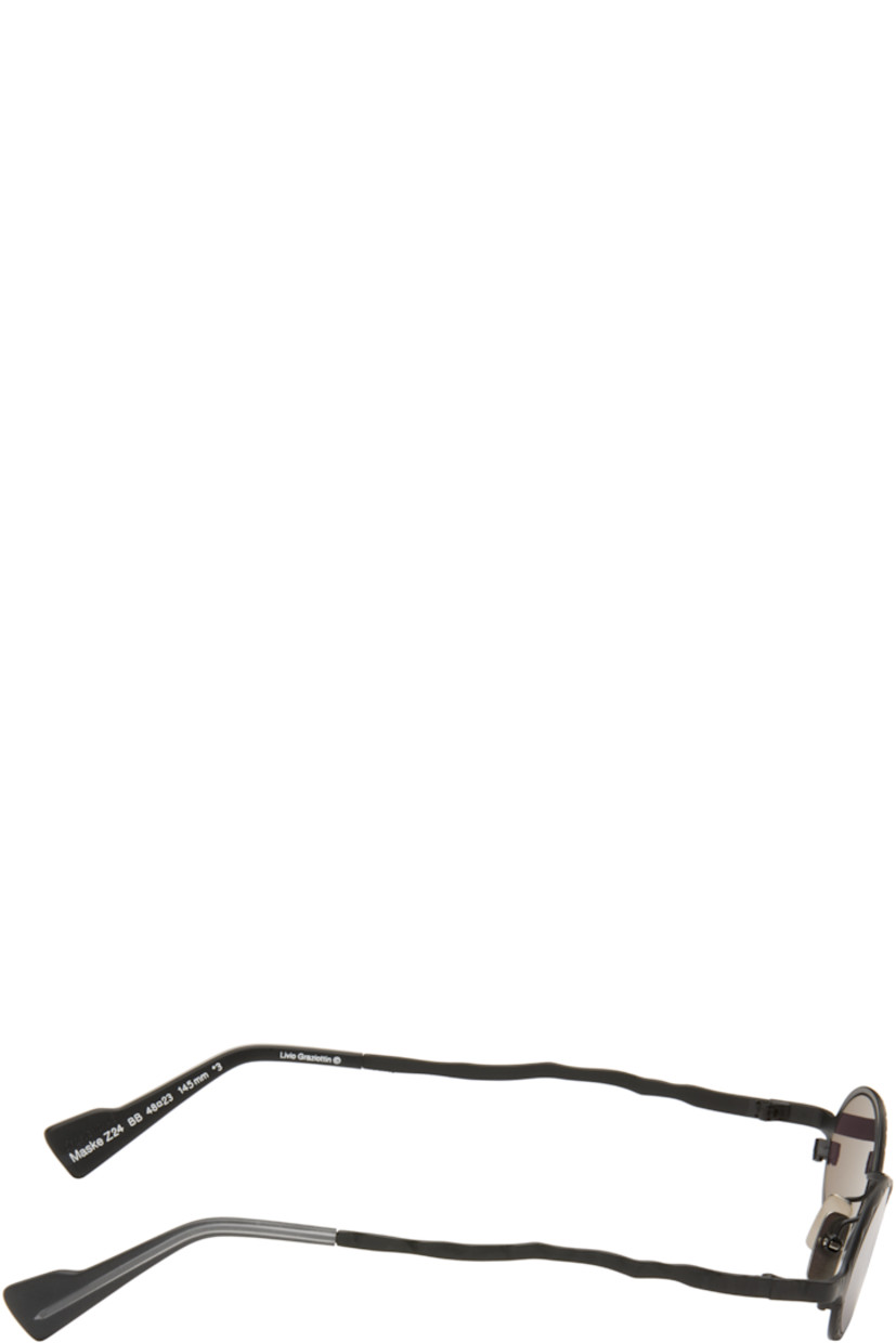Handcrafted oval metal-frame sunglasses.

· Engraved detailing throughout
· Gray lenses
· Adjustable metal nose pads
· Acetate temple tips
· Includes pouch
· Size: 48.23 145

Supplier color: Black matt