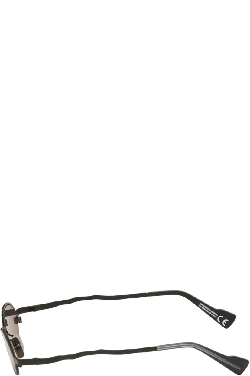 Handcrafted oval metal-frame sunglasses.

· Engraved detailing throughout
· Gray lenses
· Adjustable metal nose pads
· Acetate temple tips
· Includes pouch
· Size: 48.23 145

Supplier color: Black matt