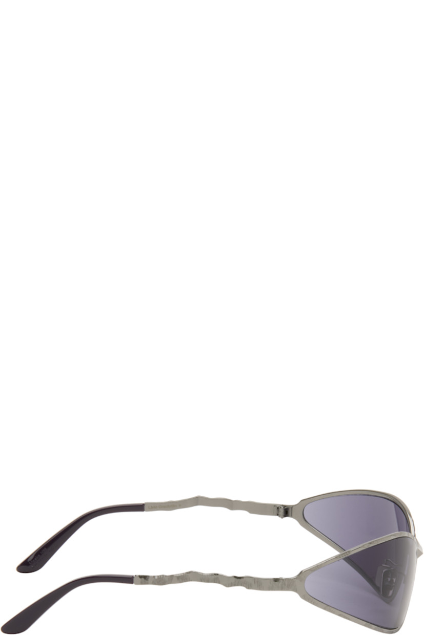 Handcrafted wraparound cat-eye metal-frame sunglasses.

· Engraved detailing throughout
· Purple lenses
· Adjustable metal nose pads
· Acetate temple tips
· Includes case
· Size: 71.17 115

Supplier color: Gunmetal
