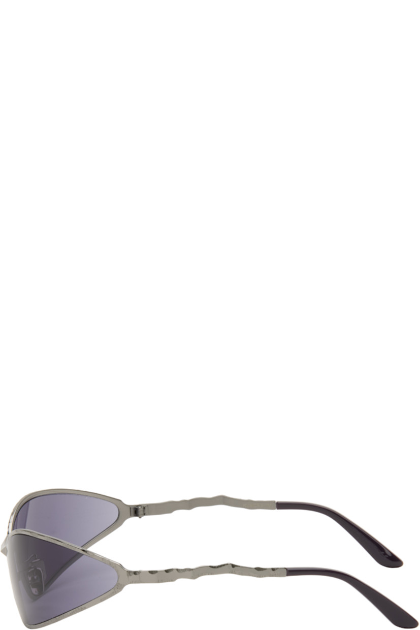 Handcrafted wraparound cat-eye metal-frame sunglasses.

· Engraved detailing throughout
· Purple lenses
· Adjustable metal nose pads
· Acetate temple tips
· Includes case
· Size: 71.17 115

Supplier color: Gunmetal
