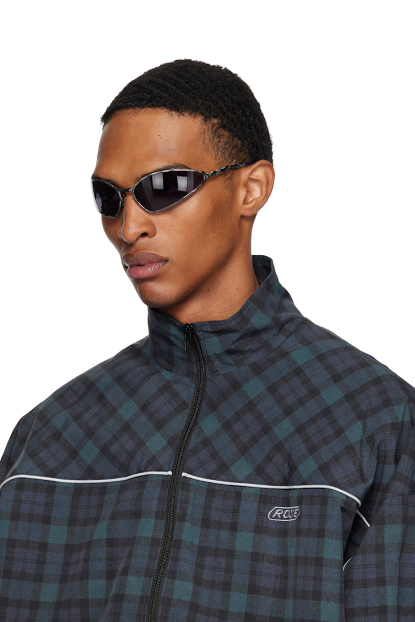 Handcrafted wraparound cat-eye metal-frame sunglasses.

· Engraved detailing throughout
· Purple lenses
· Adjustable metal nose pads
· Acetate temple tips
· Includes case
· Size: 71.17 115

Supplier color: Gunmetal