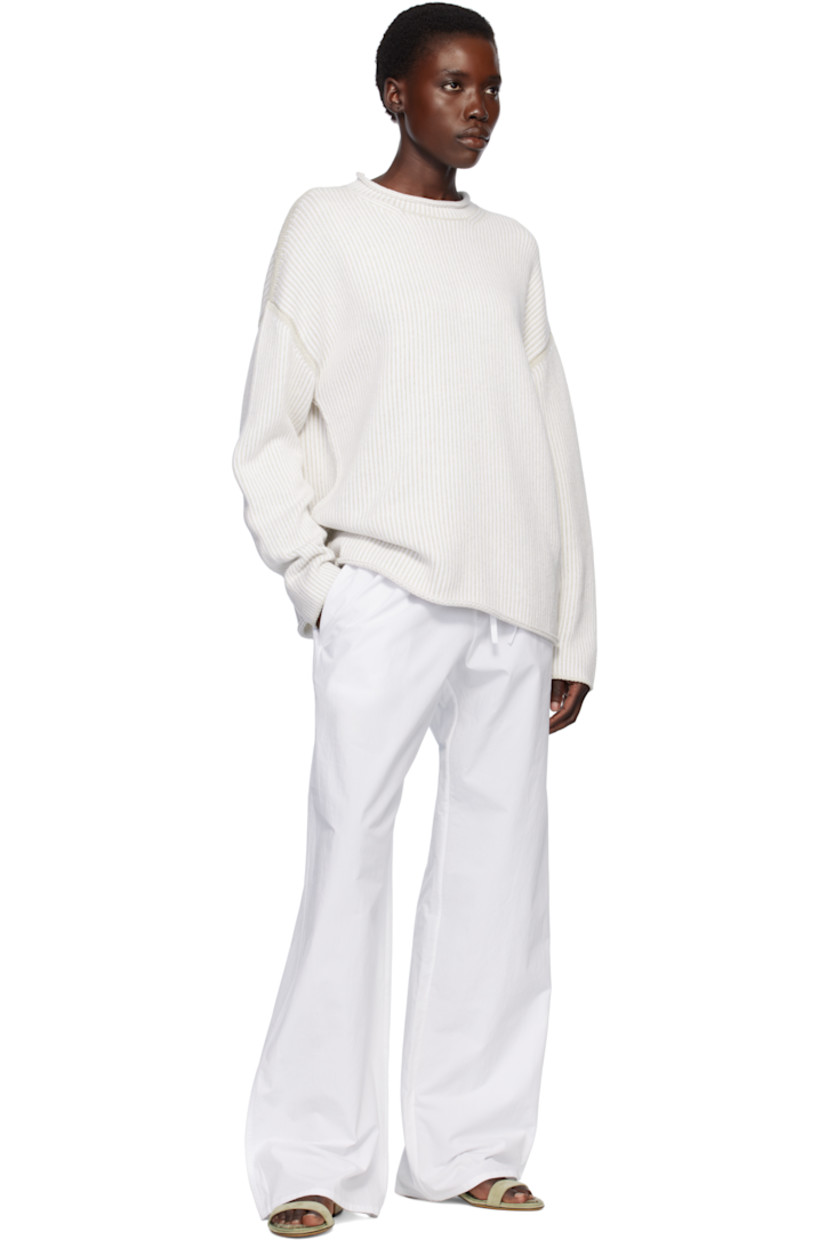 Hand-loomed knit pima cotton sweater. 

· Hand-dyed
· Rolled edge at crewneck, hem, and cuffs
· Vented side seams 
· Dropped shoulders

Supplier color: Marble/White