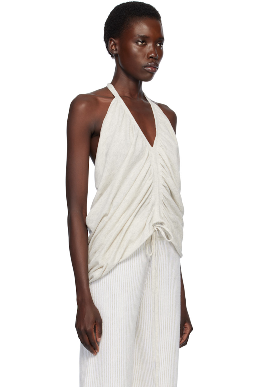 Pima cotton jersey top.

· V-neck
· Draping at chest and low back
· Rolled edge at hem 
· Self-tie halter strap

Supplier color: Marble