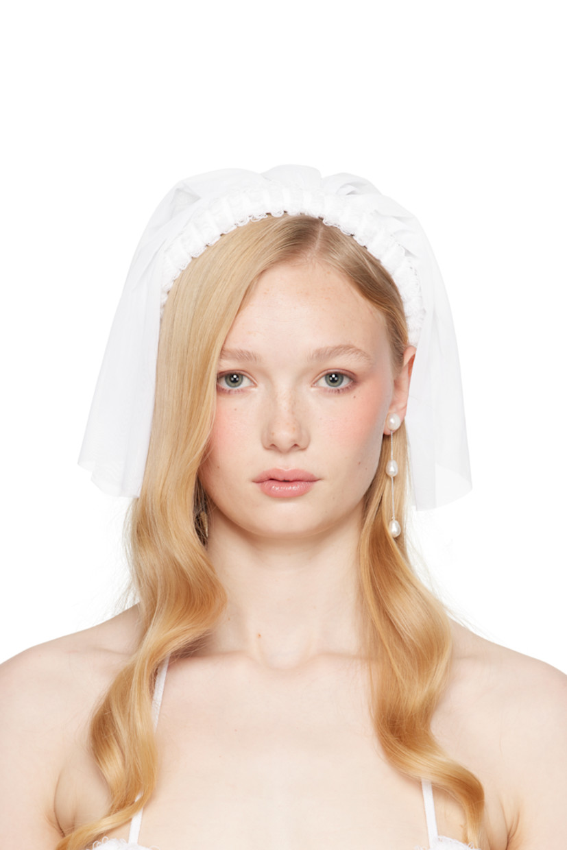 Handcrafted sheer nylon mesh veil in white.

· Laddering at rigid headband
· Self-tie fastening
· H9" x W9"

Part of the exclusive SSENSE Bridal capsule.

Supplier color: White