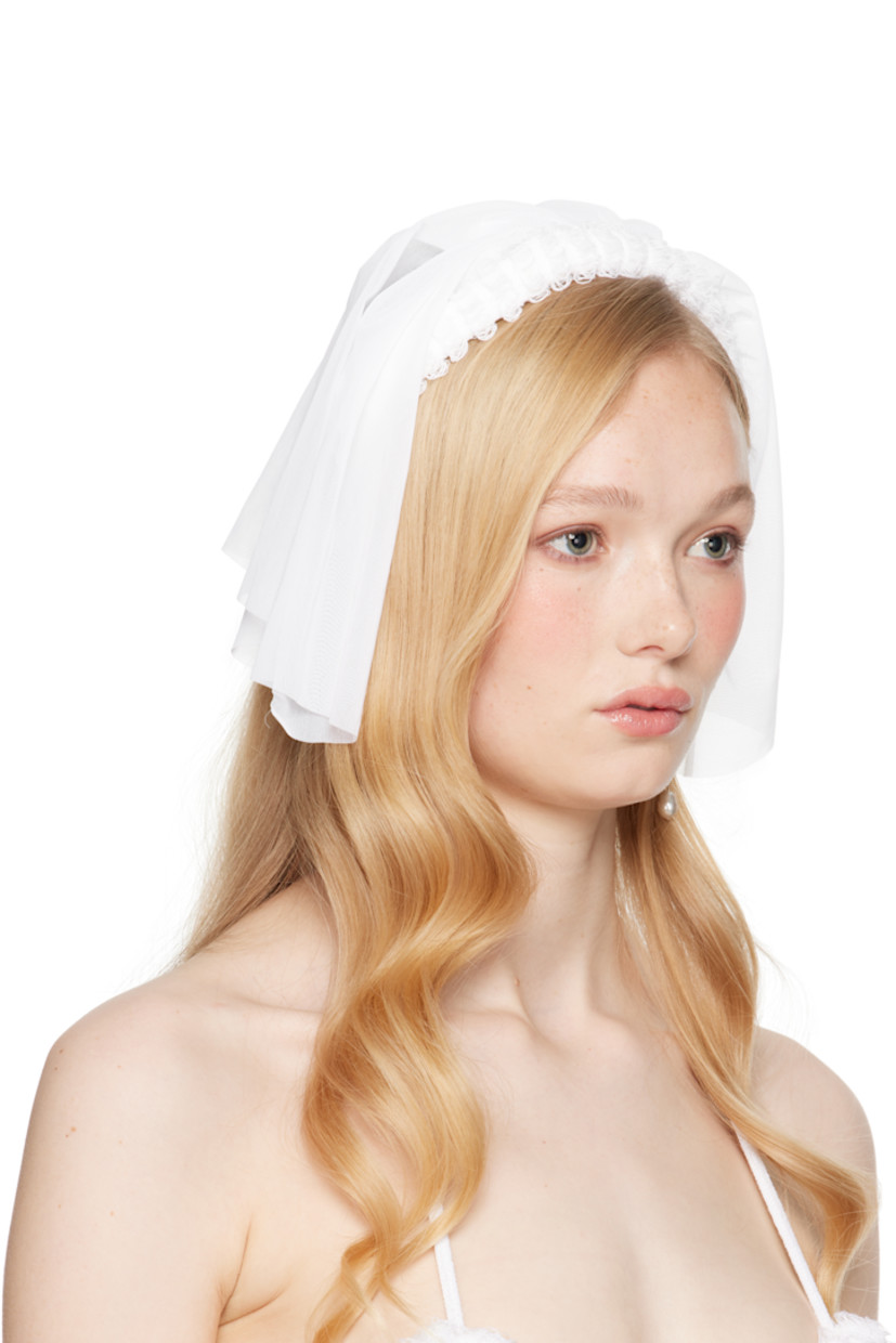 Handcrafted sheer nylon mesh veil in white.

· Laddering at rigid headband
· Self-tie fastening
· H9" x W9"

Part of the exclusive SSENSE Bridal capsule.

Supplier color: White