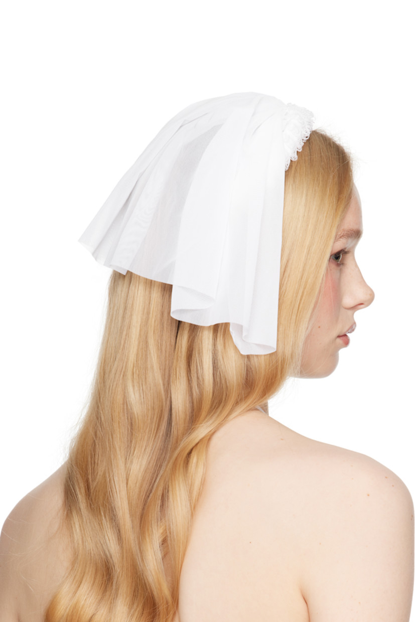 Handcrafted sheer nylon mesh veil in white.

· Laddering at rigid headband
· Self-tie fastening
· H9" x W9"

Part of the exclusive SSENSE Bridal capsule.

Supplier color: White