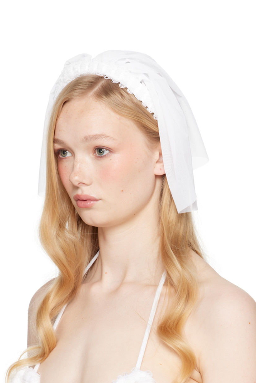 Handcrafted sheer nylon mesh veil in white.

· Laddering at rigid headband
· Self-tie fastening
· H9" x W9"

Part of the exclusive SSENSE Bridal capsule.

Supplier color: White