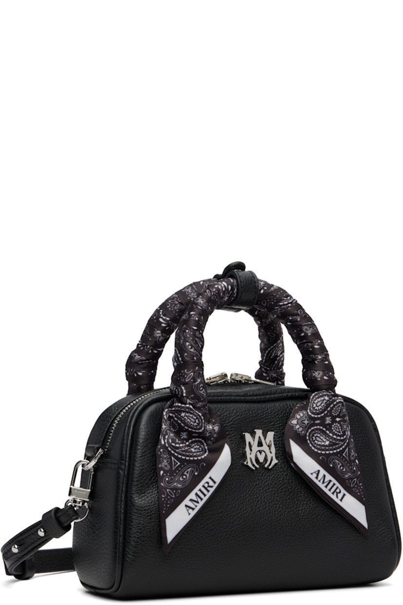Pebble-grained leather top handle bag.

· Press-stud tab at bandana-wrapped twin carry handles
· Adjustable and detachable crossbody strap
· Logo hardware at face
· Two-way zip closure
· Card slot at interior
· Logo-woven lining
· Logo-engraved silver-tone hardware
· H4.5" x W7.25" x D3"

Supplier color: Black