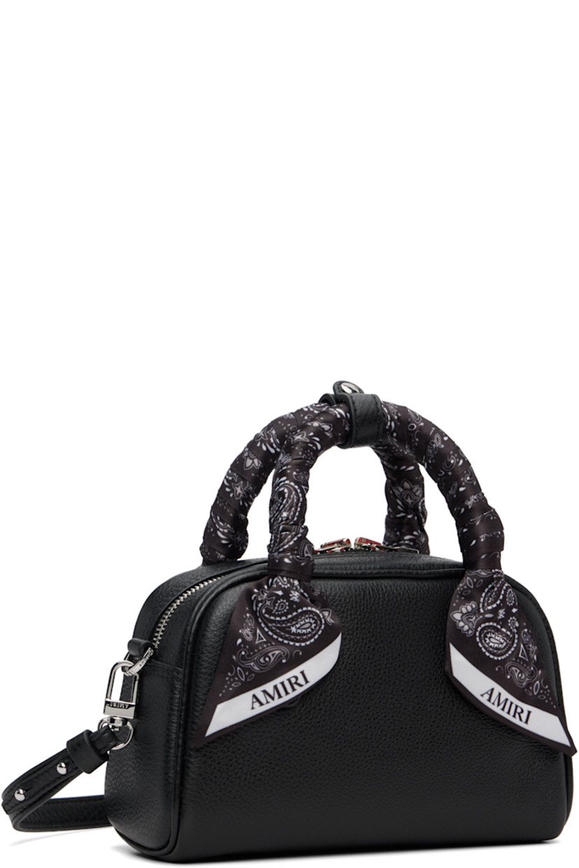 Pebble-grained leather top handle bag.

· Press-stud tab at bandana-wrapped twin carry handles
· Adjustable and detachable crossbody strap
· Logo hardware at face
· Two-way zip closure
· Card slot at interior
· Logo-woven lining
· Logo-engraved silver-tone hardware
· H4.5" x W7.25" x D3"

Supplier color: Black