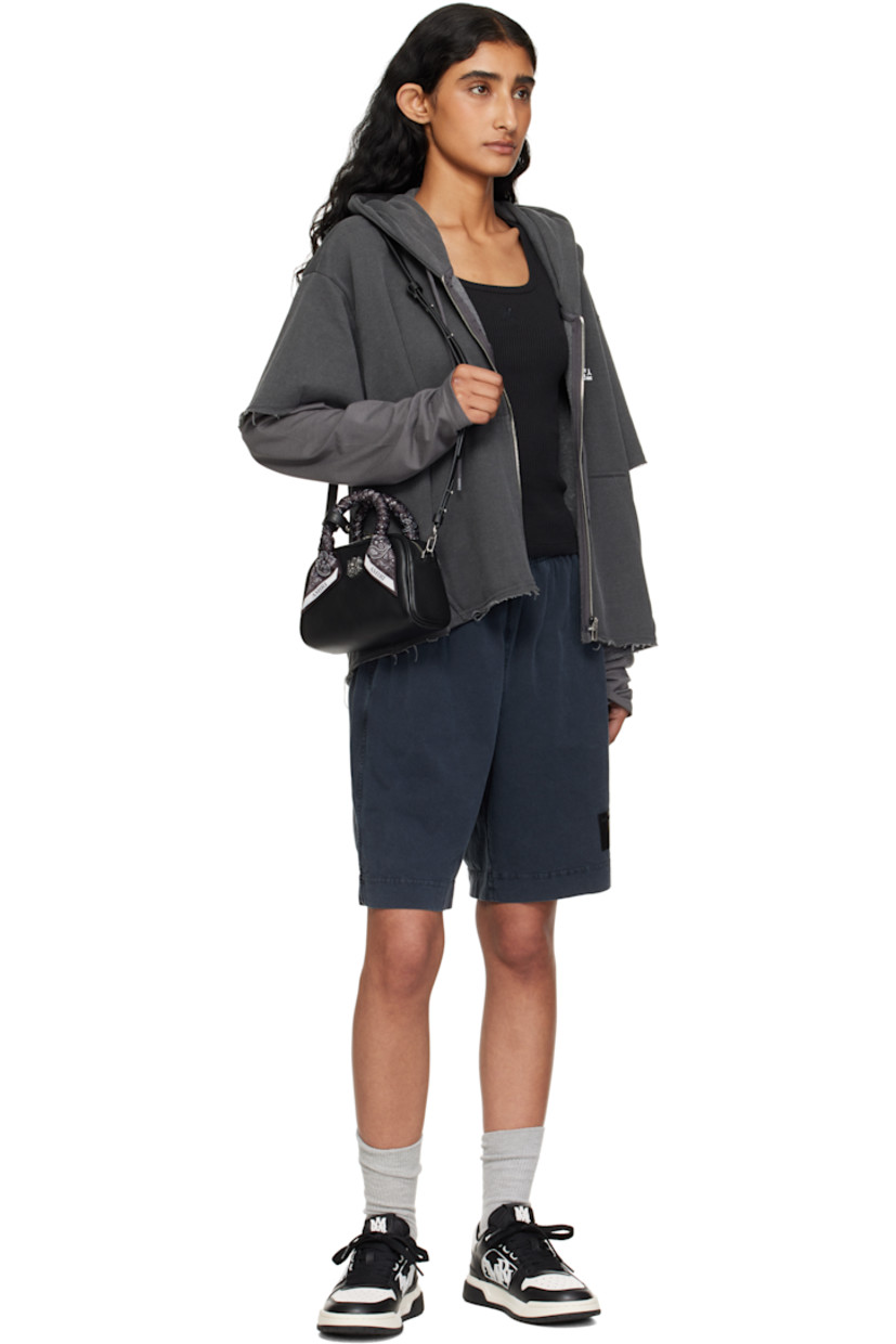 Pebble-grained leather top handle bag.

· Press-stud tab at bandana-wrapped twin carry handles
· Adjustable and detachable crossbody strap
· Logo hardware at face
· Two-way zip closure
· Card slot at interior
· Logo-woven lining
· Logo-engraved silver-tone hardware
· H4.5" x W7.25" x D3"

Supplier color: Black