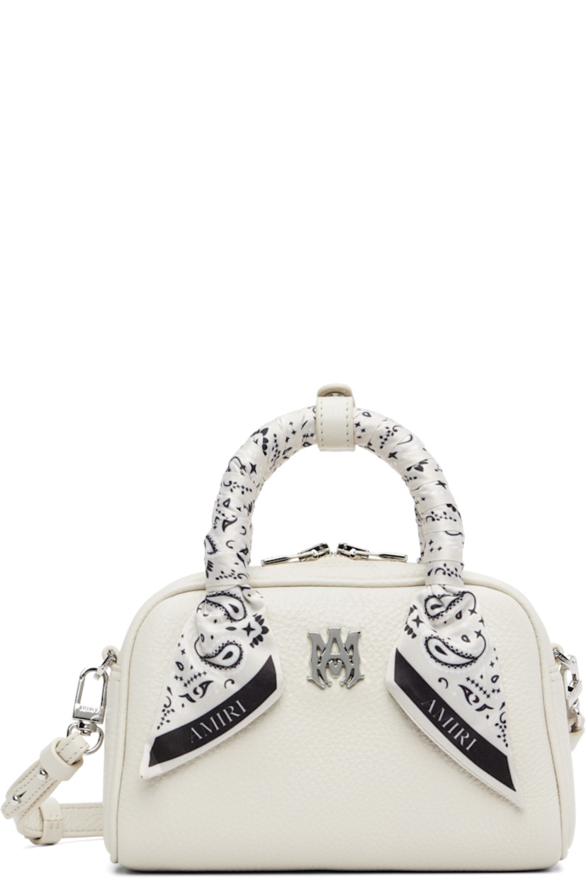 Pebble-grained leather top handle bag.

· Press-stud tab at bandana-wrapped twin carry handles
· Adjustable and detachable crossbody strap
· Logo hardware at face
· Two-way zip closure
· Card slot at interior
· Logo-woven lining
· Logo-engraved silver-tone hardware
· H4.5" x W7.25" x D3"

Supplier color: Alabaster