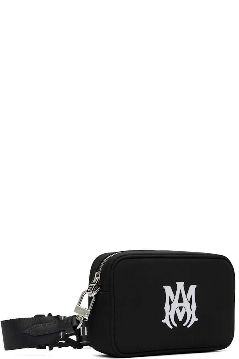 Nylon twill shoulder bag.

· Adjustable and detachable logo-woven shoulder strap
· Logo press-release fastening at strap
· Logo bonded at face
· Zip closure
· Logo-woven lining
· Logo-engraved silver-tone hardware
· H5" x W7.5" x D2"

Part of the Core collection.

Supplier color: Black