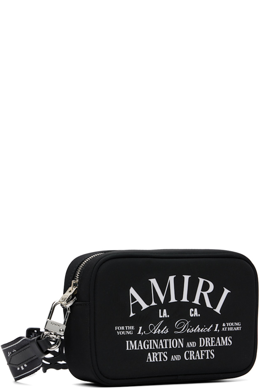 Nylon twill shoulder bag.

· Adjustable and detachable logo-woven shoulder strap
· Logo press-release fastening at strap
· Logo and text printed at face
· Zip closure
· Logo-woven lining
· Logo-engraved silver-tone hardware
· H5" x W7.5" x D2"

Part of the Core collection.

Supplier color: Black