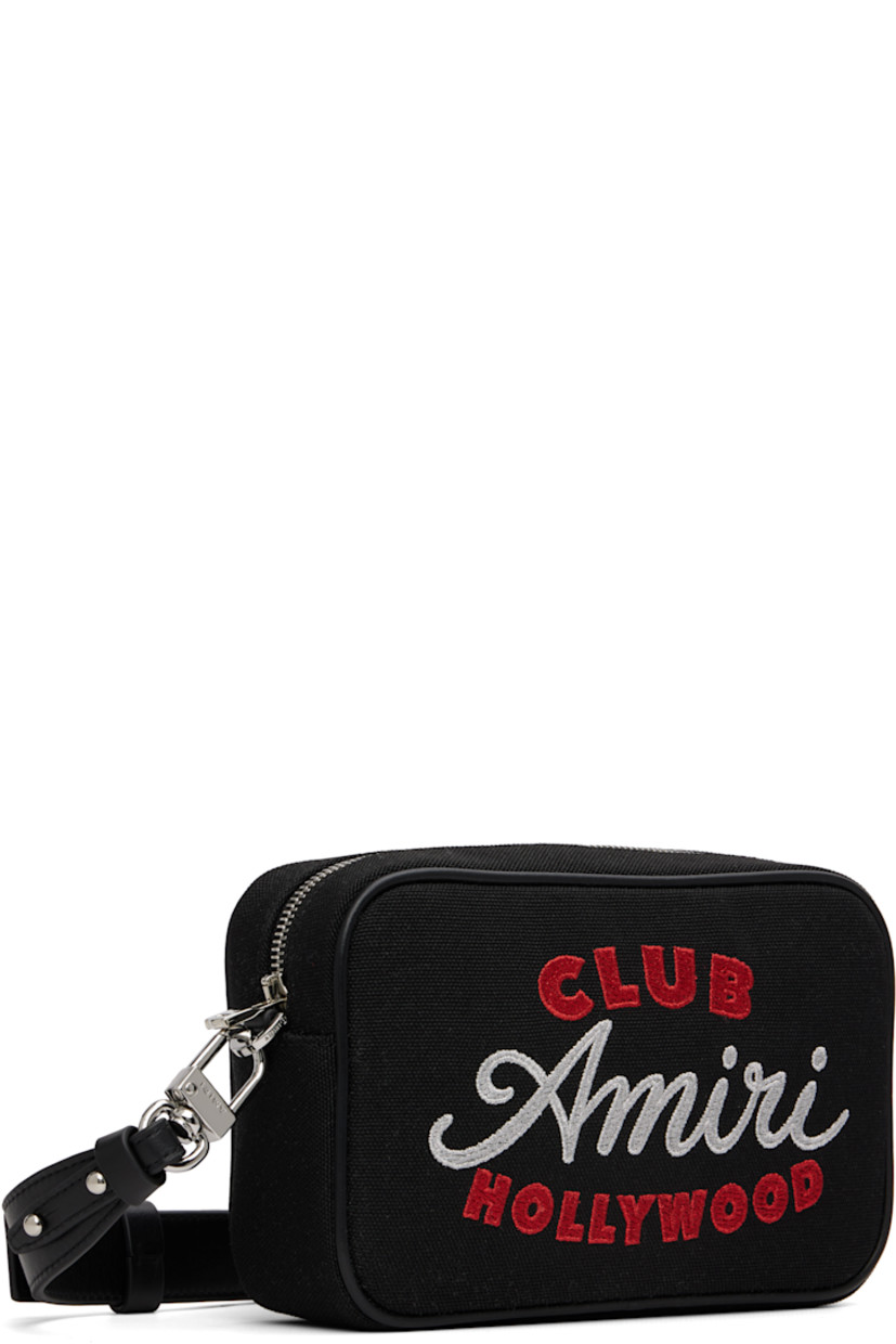 Canvas shoulder bag.

· Adjustable and detachable leather crossbody strap
· Logo embroidered at face
· Zip closure
· Logo-patterned textile lining
· H5" x W8" x D2.5"

Supplier color: Black