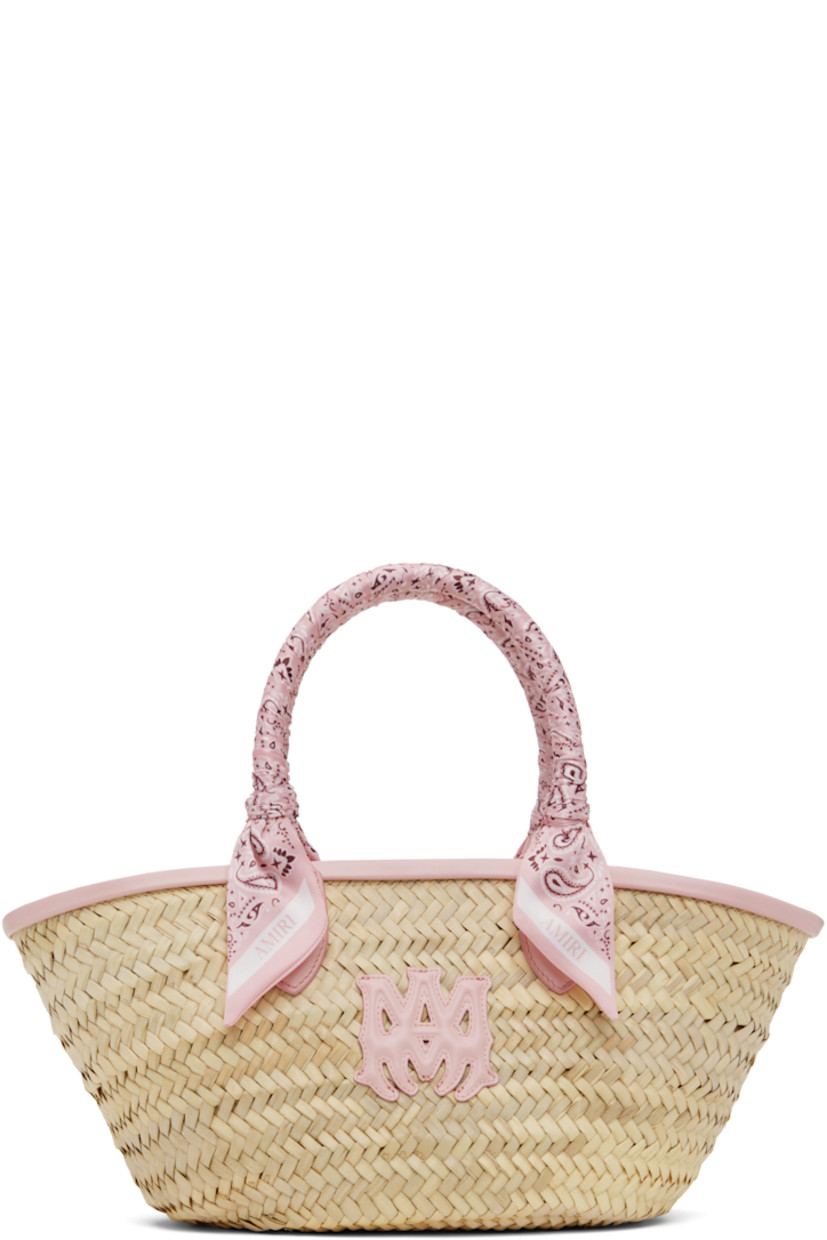 Woven raffia tote in beige. 

· Buffed leather trim in pink throughout
· Bandana-wrapped carry handles
· Logo appliqué at face
· Clasp at throat
· Unlined
· H7.5" x W15" x D5"

Supplier color: Dusk pink