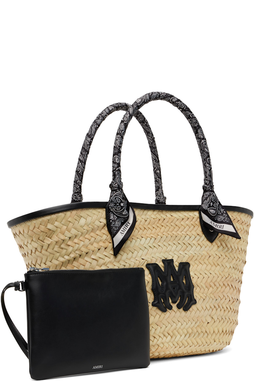 Woven straw tote in beige.

· Buffed leather trim in black throughout
· Bandana-wrapped carry handles
· Logo appliqué at face
· Clasp at throat
· Detachable zip pouch at interior
· H10" x W19" x D5.5"

Supplier color: Black