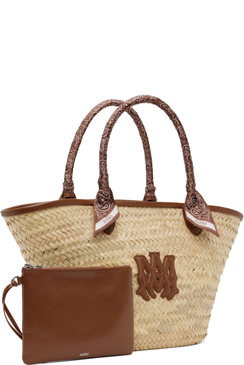 Woven straw tote in beige.

· Buffed leather trim in brown throughout
· Bandana-wrapped carry handles
· Logo appliqué at face
· Clasp at throat
· Detachable zip pouch at interior
· H10" x W19" x D5.5"

Supplier color: Brown