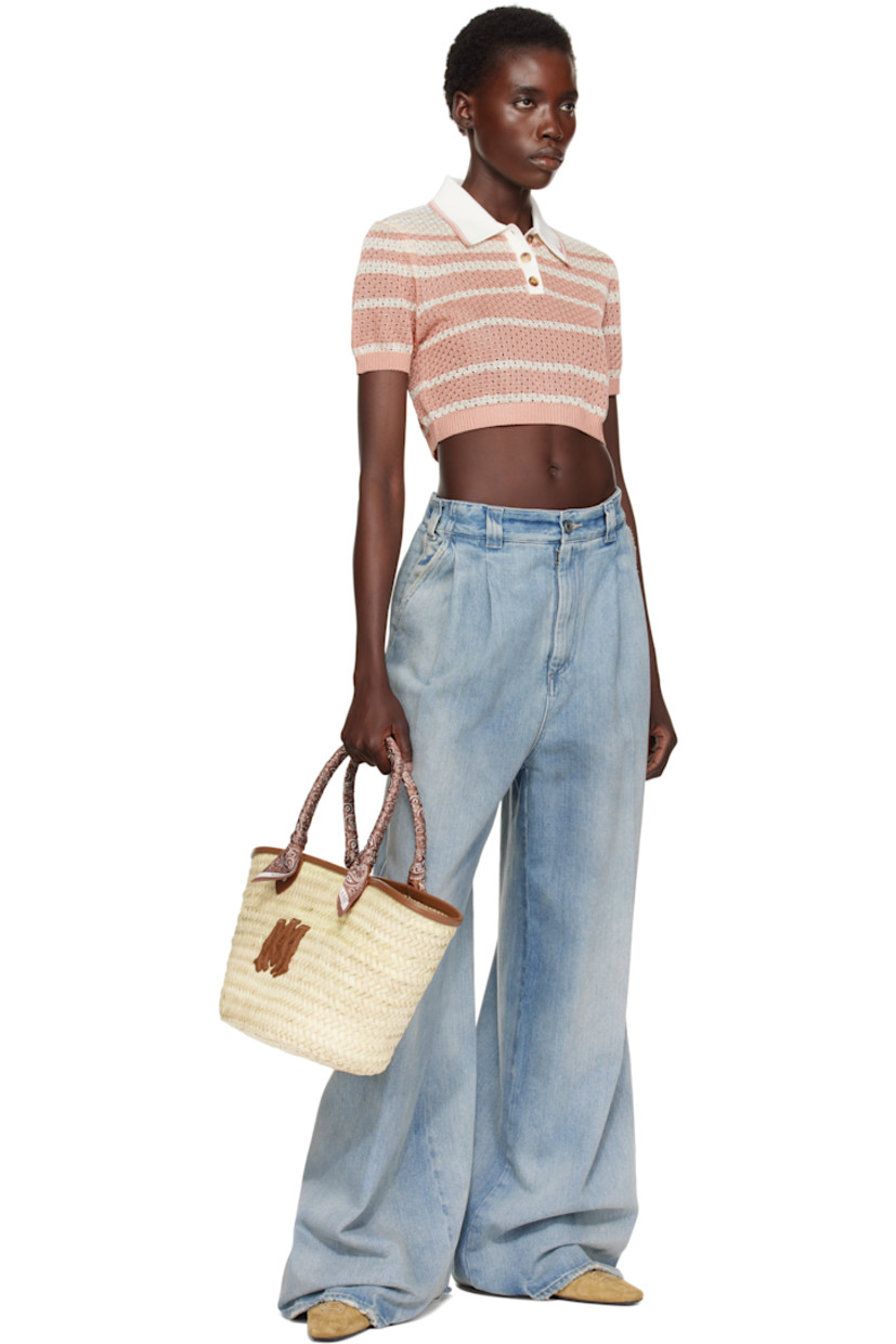 Woven straw tote in beige.

· Buffed leather trim in brown throughout
· Bandana-wrapped carry handles
· Logo appliqué at face
· Clasp at throat
· Detachable zip pouch at interior
· H10" x W19" x D5.5"

Supplier color: Brown