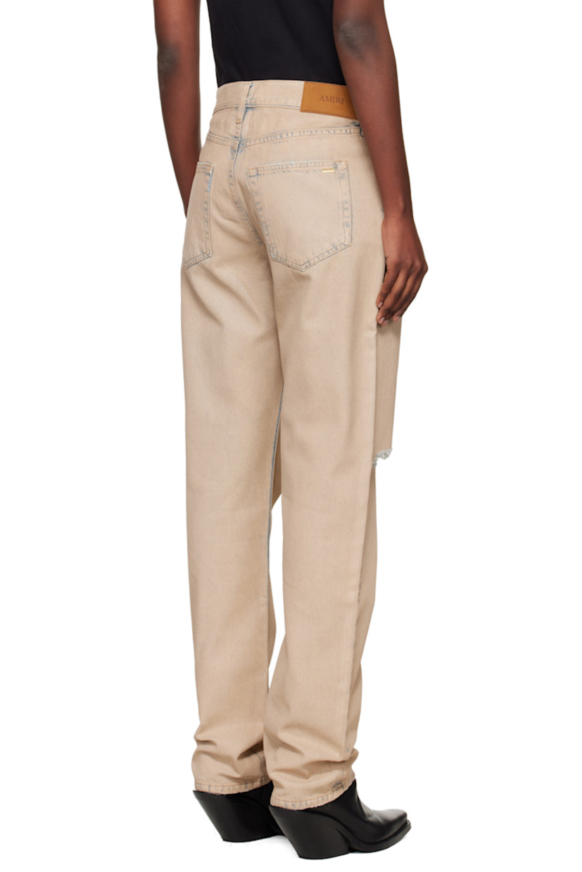 Non-stretch denim jeans.

· Fading and distressing throughout
· Belt loops
· Five-pocket styling
· Button fly
· Logo charm at front waistband
· Logo patch at back waistband
· Logo plaque at back pocket

Supplier color: Indigo desert