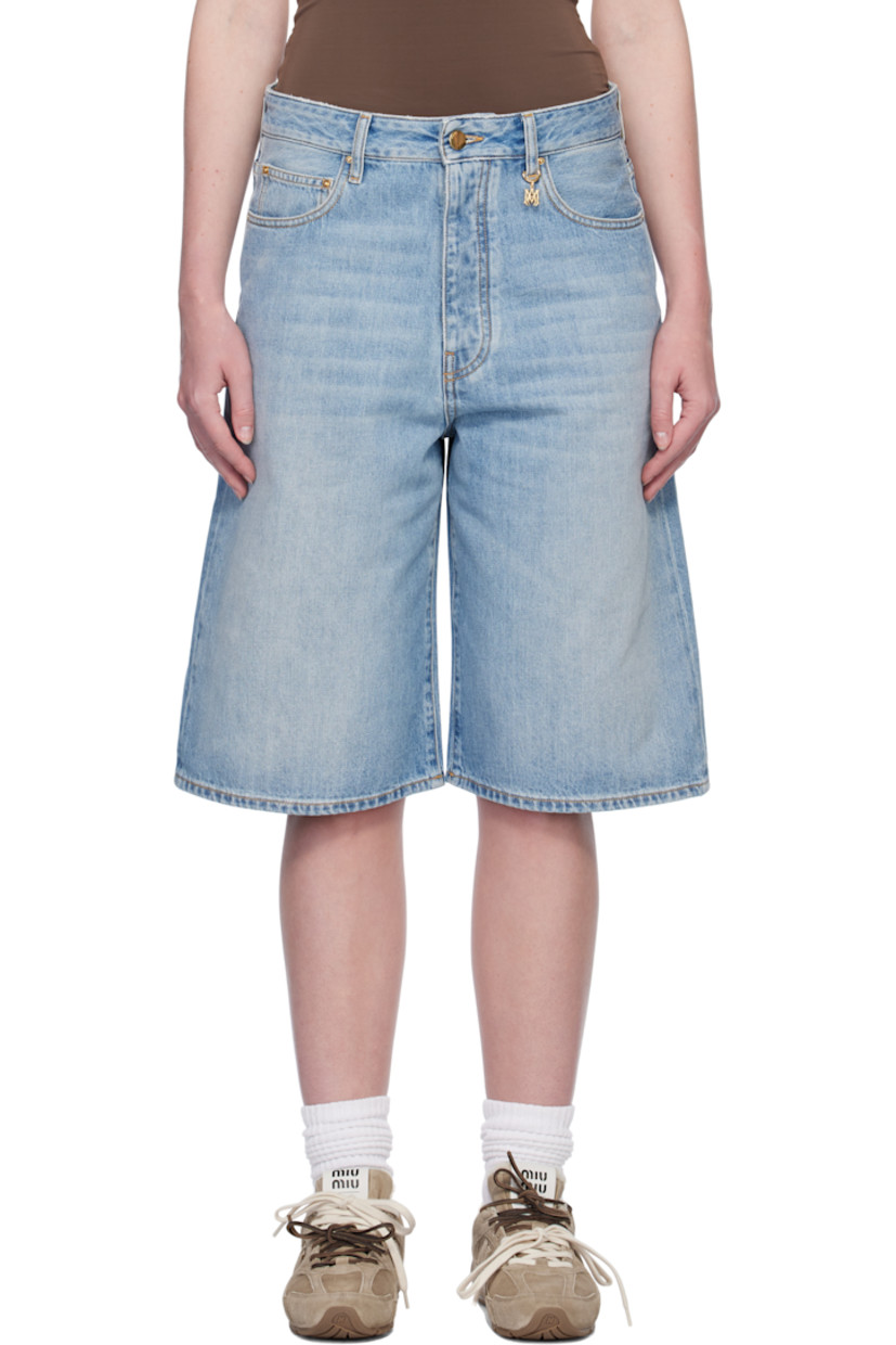 Non-stretch denim shorts. Fading, whiskering, and subtle distressing throughout.

· Belt loops
· Five-pocket styling
· Button fly
· Logo charm at belt loop and back pocket
· Logo patch at back waistband
· Contrast stitching in tan

Supplier color: Stone indigo