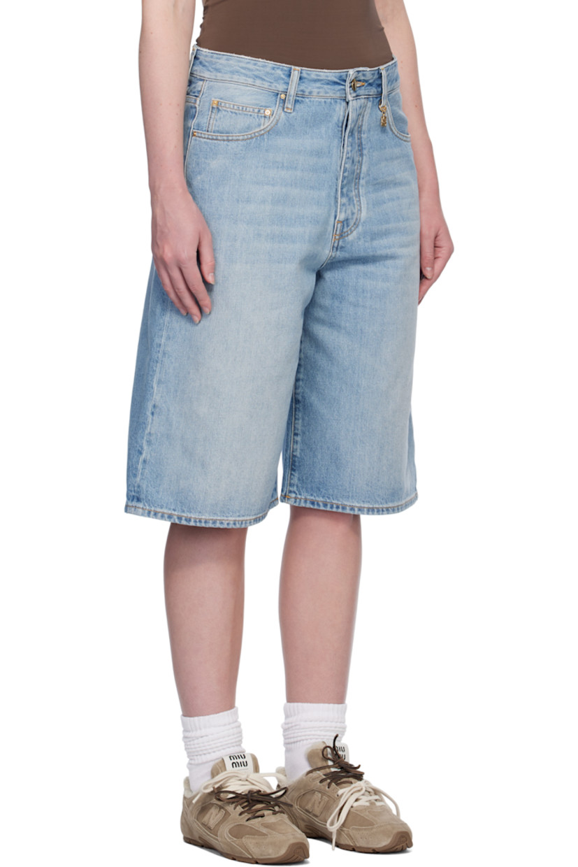 Non-stretch denim shorts. Fading, whiskering, and subtle distressing throughout.

· Belt loops
· Five-pocket styling
· Button fly
· Logo charm at belt loop and back pocket
· Logo patch at back waistband
· Contrast stitching in tan

Supplier color: Stone indigo