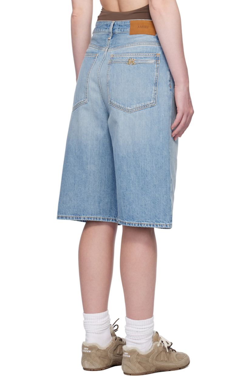 Non-stretch denim shorts. Fading, whiskering, and subtle distressing throughout.

· Belt loops
· Five-pocket styling
· Button fly
· Logo charm at belt loop and back pocket
· Logo patch at back waistband
· Contrast stitching in tan

Supplier color: Stone indigo