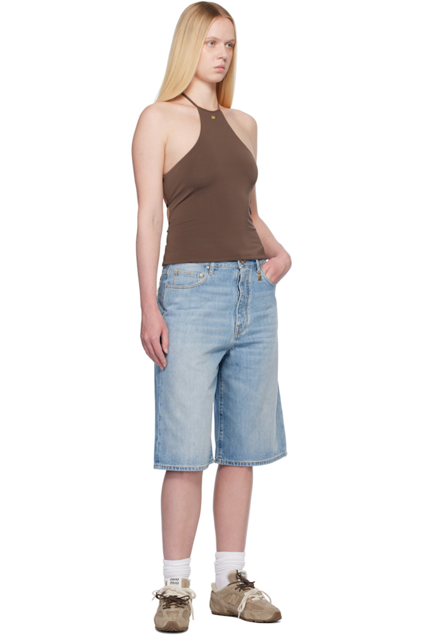 Non-stretch denim shorts. Fading, whiskering, and subtle distressing throughout.

· Belt loops
· Five-pocket styling
· Button fly
· Logo charm at belt loop and back pocket
· Logo patch at back waistband
· Contrast stitching in tan

Supplier color: Stone indigo