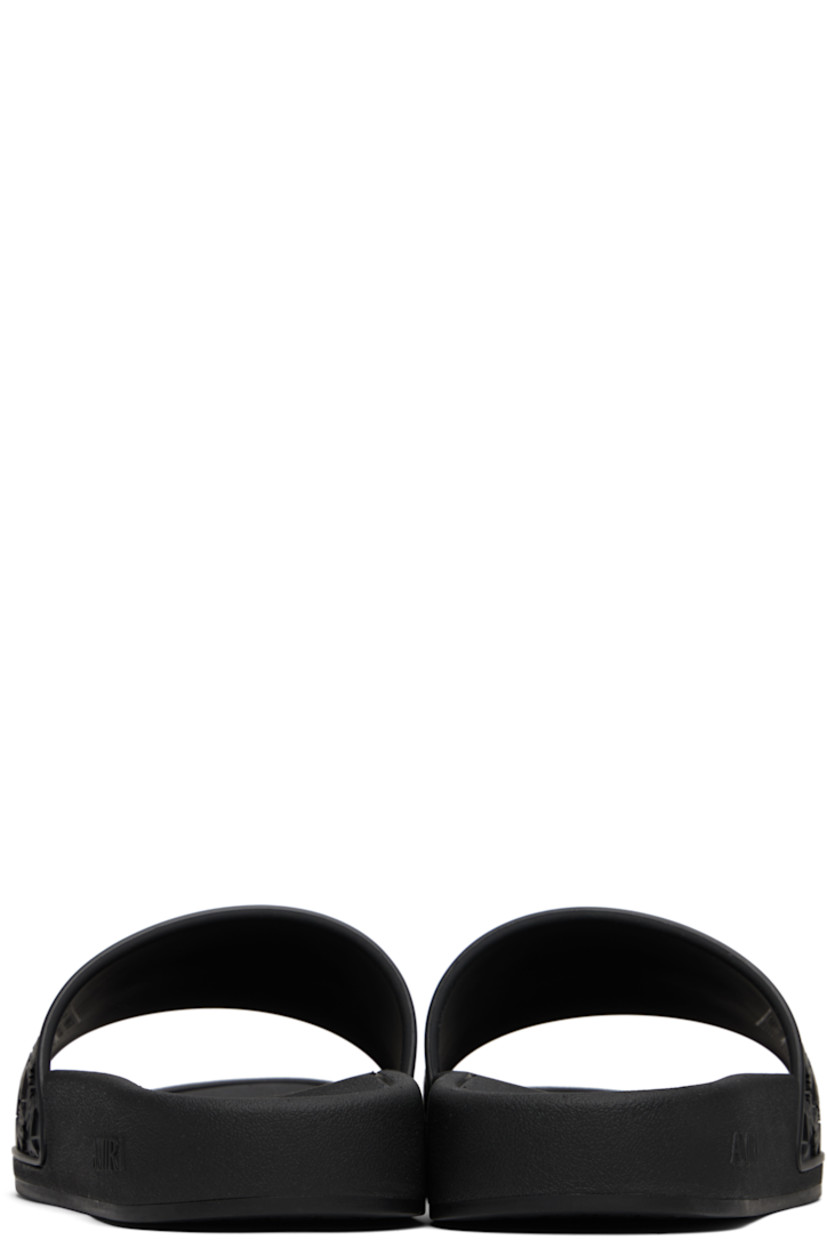 Rubber pool slides.

· Open toe
· Logo and pattern embossed at vamp
· Treaded rubber sole

Supplier color: Black